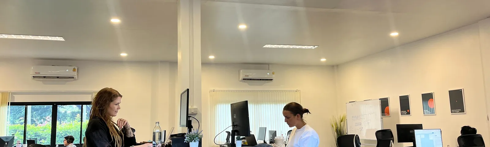 Azendo software engineers working at desks in the Chiang Mai delivery centre
