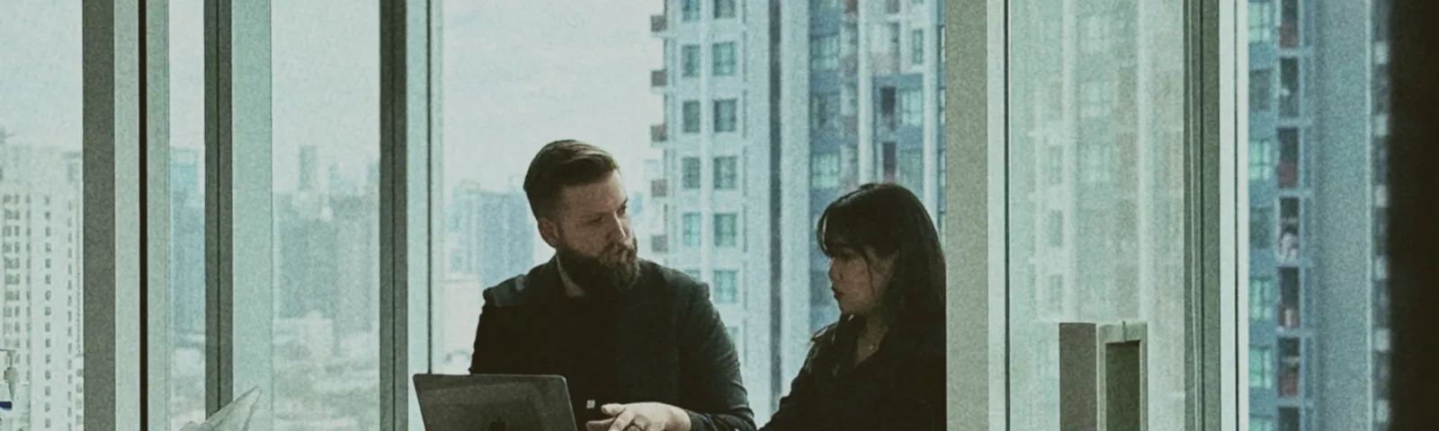 An Azendo data scientist reviewing findings with a colleague
