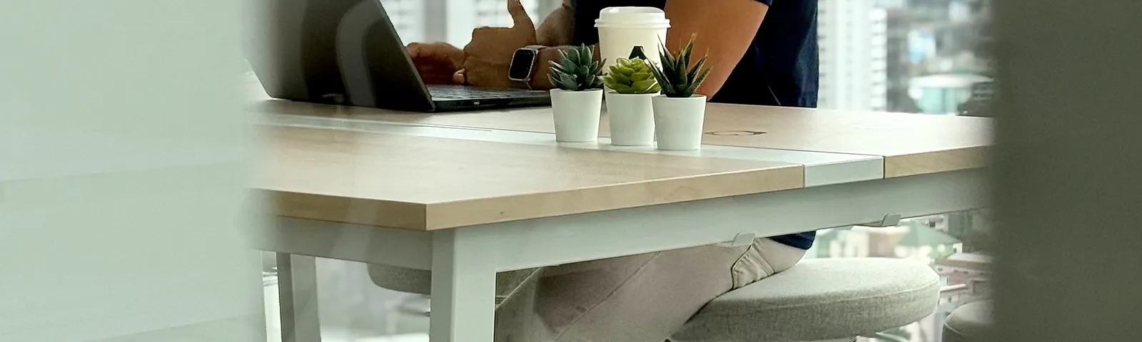 An Azendo MLOps specialist at work by the window