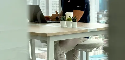 A software specialist working by the window in Bangkok